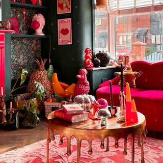 A pink and red maximalist-inspired living room