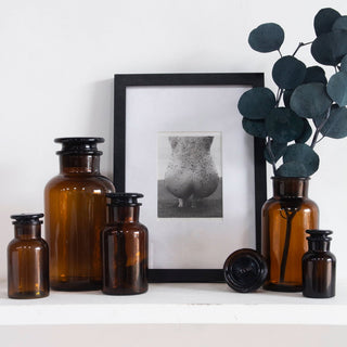 Kitchen storage jars on a shelf. 