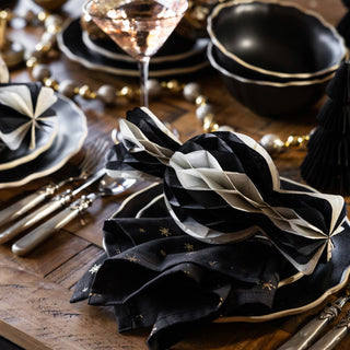 image of Christmas table setting with black and gold accessories