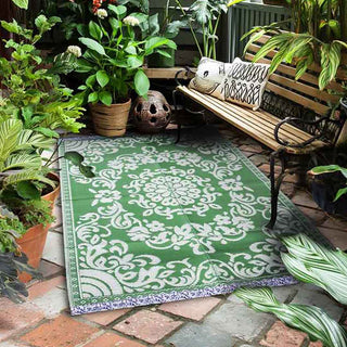 GReen rug in a leafy conservatory