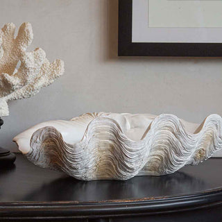 white faux clam shell on a black sideboard