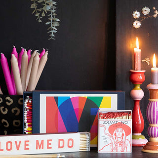 Lots of colourful matches and candlesticks