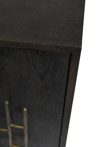 Corner of a black mango wood cabinet