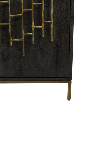 Bottom right corner of a black mango wood cabinet detailing the short brass legs and bronze-effect fretwork handles 