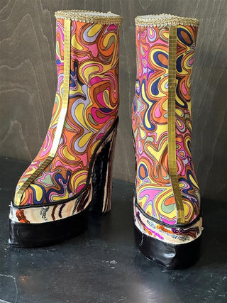 The front view of the retro pattern groovy platform boots.