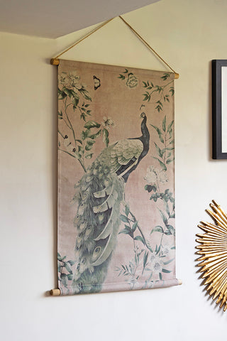 The Large Peacock Wall Art displayed on the wall with an art print and a wall decoration.