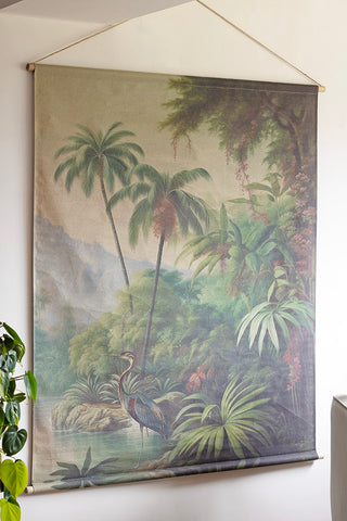 The Large Rainforest Wall Art on the wall, styled next to a plant.