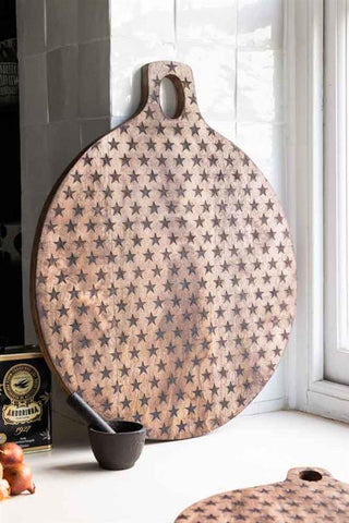 Large wooden round serving board with black star detail inlaid