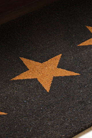 Detail shot of one of the stars on the Large Triple Star Doormat.