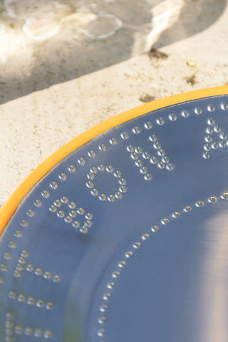 Close-up of the Metal & Orange Rim Bon Appetit Dinner Plate.