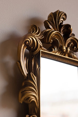 Close-up of the corner of the Ornamental Wall Shelf with Mirror.