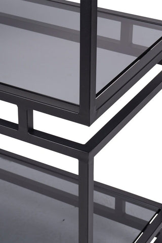 Corner detailing of a metal and glass display cabinet 