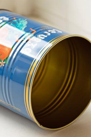 Close-up of one of the tins from the Set Of 2 Flamenco & Orange Kitchen Storage Tins on its side.