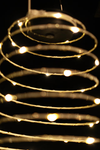 Detail shot of the illuminated Spiral Solar Exterior Lamp.