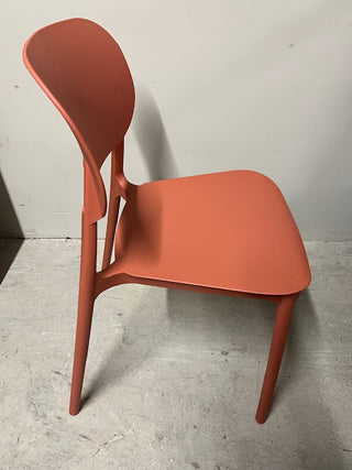 Side view of orange plastic chair