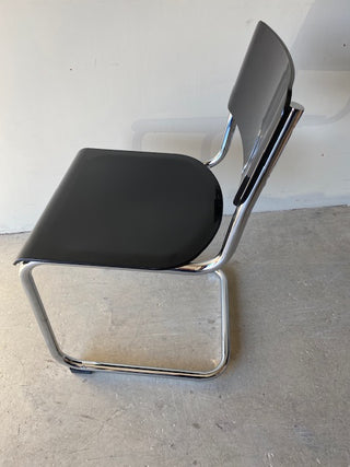 Left side view of black retro dining chair