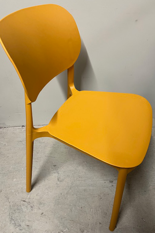 Side view of plastic yellow chair