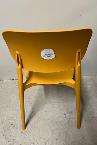 Back view of yellow ochre chair showing product sticker on back rest