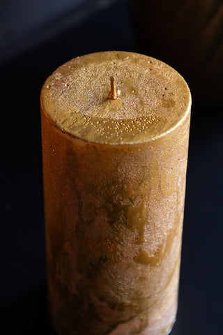 Detail shot of the top of the Shiny Gold Pillar Candle - Tall.