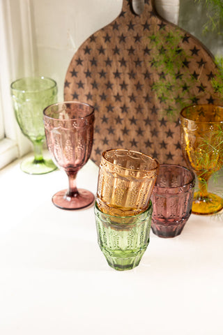 Three of the Set of 6 Colourful Vintage-Style Wine Glasses styled with some matching tumblers and a serving board.