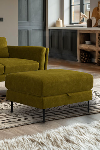 The Grace Foot Stool In Luxe Kneedlecord Velvet Vintage Green styled in front of a matching sofa.