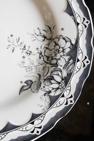 Detail image of the print of the 12-Piece Vintage-Style Floral & Star Dinner Set.