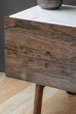 A close up of The Acacia Wood & Marble TV Unit showing the wood grain