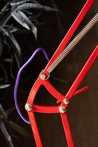 Close-up of the Adjustable Red Task Floor Lamp with Purple Flex.