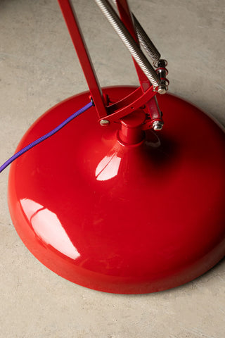 Close-up of the base of the Adjustable Red Task Floor Lamp with Purple Flex.