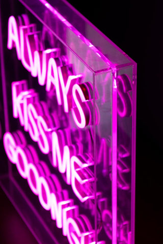 Detail shot of the Always Kiss Me Goodnight Neon Light Box, switched on and seen from a side angle.