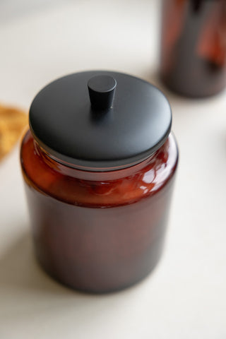 Close-up of the lid of the Apothecary-Style Amber Glass Storage Cannister.