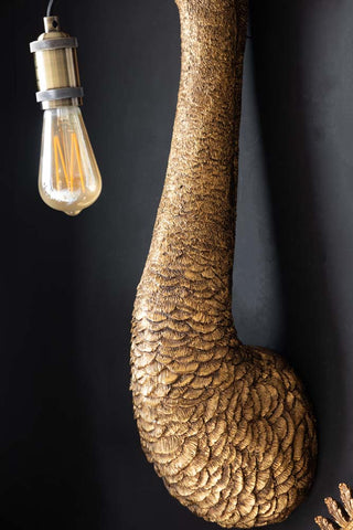 Close-up of the base of the Antique Bronze Ostrich Wall Light.