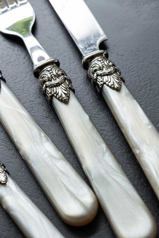 Detail shot of the handles of the Antique Champagne Cutlery 4-Piece Set.