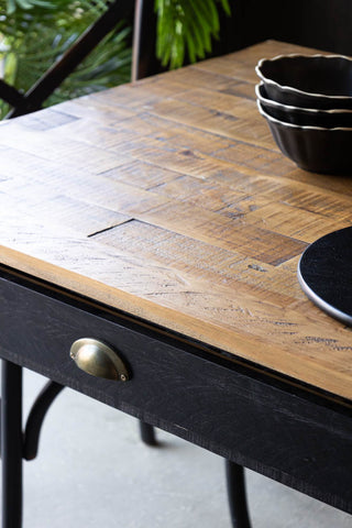 Close-up of the top of the Apothecary Dining Table.