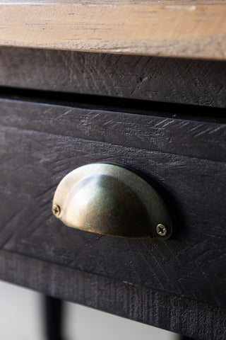 Close-up of the drawer handle on the Apothecary Dining Table.