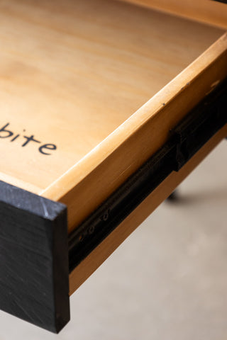 Close-up of the drawer of the Apothecary Dining Table.