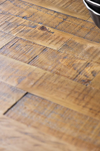 Detail shot of the wooden top of the Apothecary Dining Table.