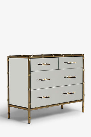 Cutout of the Mirrored Bamboo Effect Chest Of Drawers seen from a side angle, on a white background.