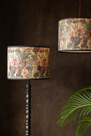 The Bamboo Floral Print Easyfit Lampshade displayed on a floor lamp and as a pendant shade, styled above a large plant.