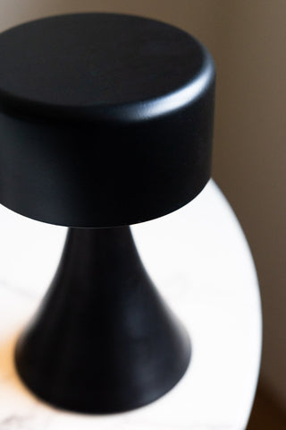 Close-up of the Battery-Powered Cordless Table Lamp In Black seen from above.