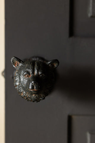 Close-up of the Bear Door Knob on a door.