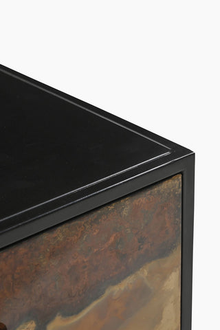 Close-up of the corner of the Beautiful Burnished Metal Bedside Table.