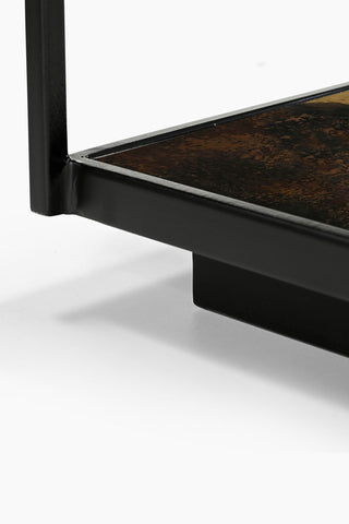 Close-up of the corner of the Beautiful Burnished Metal & Glass Coffee Table.