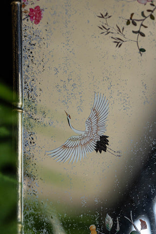 Close-up of one of the bird motifs on the Beautiful Pink Chinoiserie Decorative Mirror.