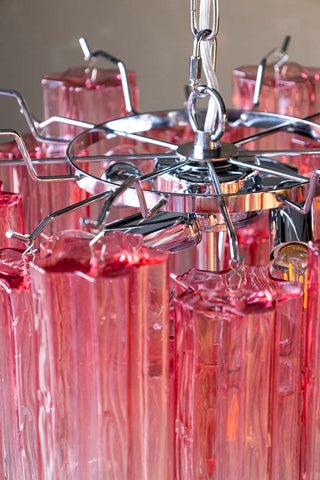 Close-up of the top of the Beautiful Waved Glass Chandelier in Pink.