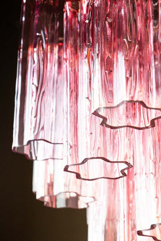 Close-up of the Beautiful Waved Glass Chandelier in Pink seen from below.