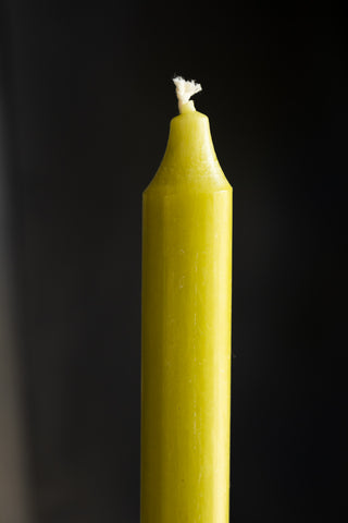 Beautiful Dinner Candle - Lime Green against dark wall detail