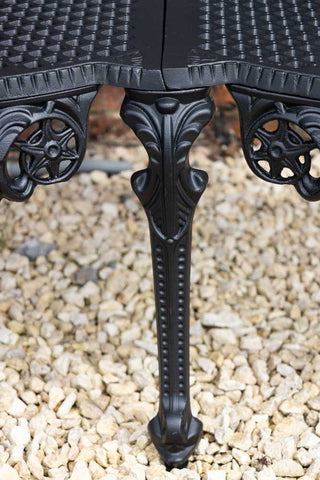 Detail shot of the leg of the Black Antique-Style Garden Bench.