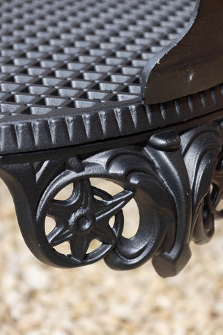 Close-up of the design of the Black Antique-Style Garden Bench.