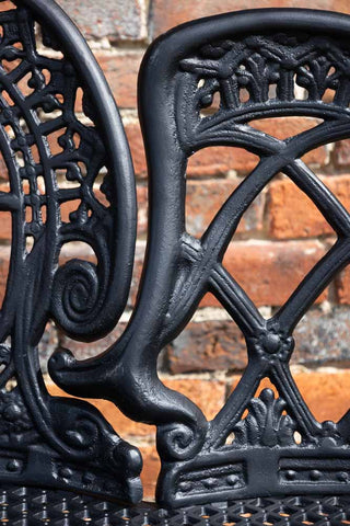 Detail shot of the ornate design of the Black Antique-Style Garden Bench.